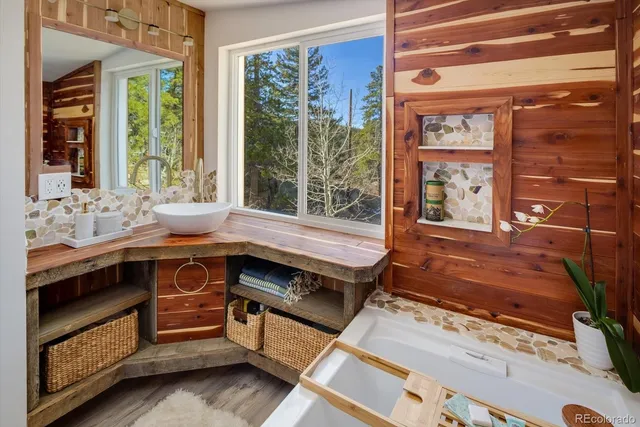 a bathroom with a sink and a window