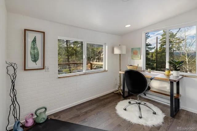 a dining room with furniture and a window