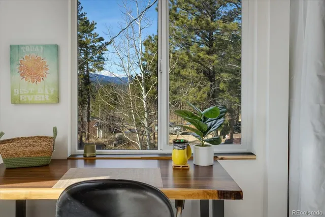 a kitchen with a refrigerator and a stove