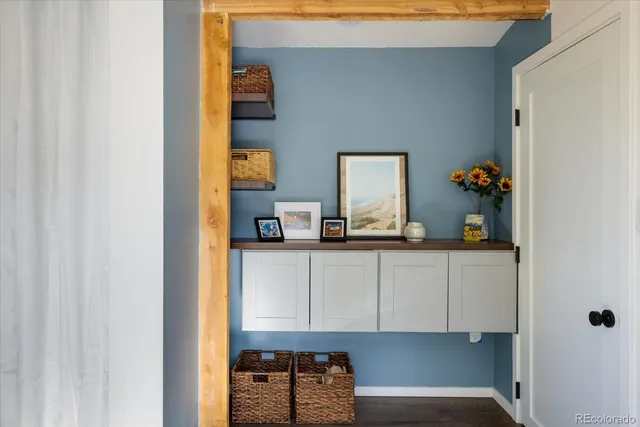 a backyard of a house with barbeque oven and outdoor seating