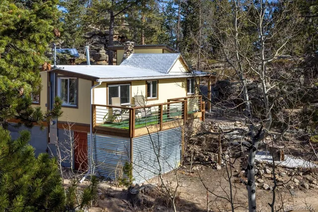 a view of a backyard with sitting area
