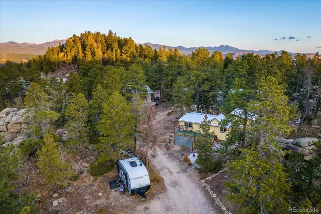 a view of a lot of trees and mountains