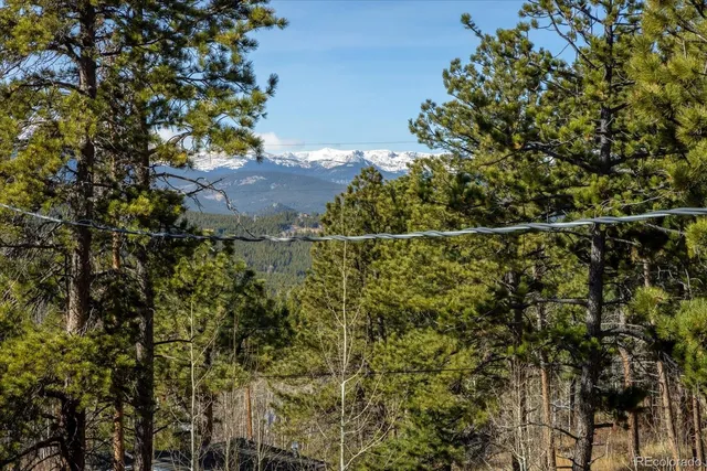 a view of a porch with furniture and floor to ceiling window