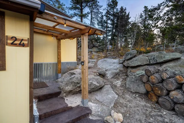 a view of a livingroom with furniture and a fireplace