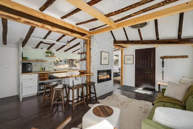 a room with stainless steel appliances kitchen island granite countertop furniture and a kitchen view