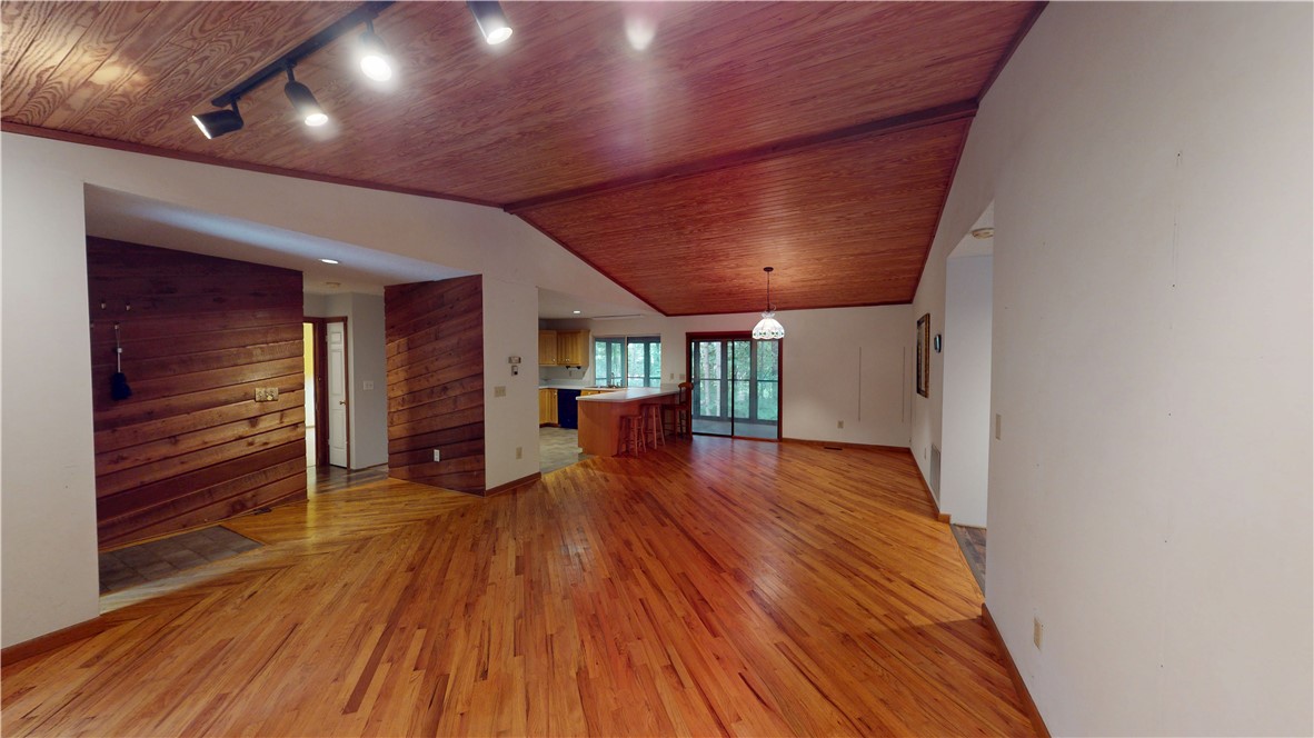118 Century Court Pendleton, SC 29670 - Photo 6 of 31 Rich hardwood floors flow through this open-concept space, leading to a modern kitchen with a breakfast bar