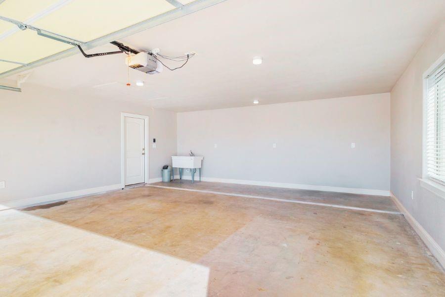 4319 County Road 337 Early, TX 76802 - Photo 22 of 31 Garage with a sink and a garage door opener