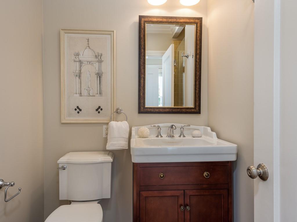 820 Crescent Avenue San Mateo, CA 94401 - Photo 12 of 27 a bathroom with a toilet sink and mirror