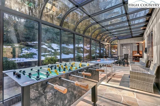 a view of a swimming pool with sitting area