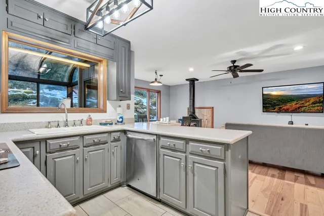 a kitchen with a sink stove and refrigerator