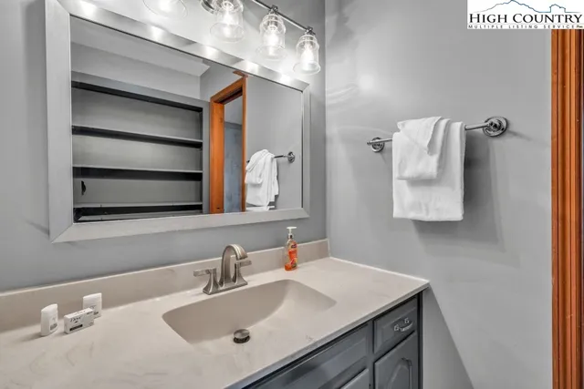 a bathroom with a sink and a mirror