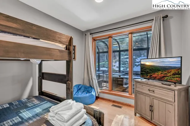 a bathroom with a granite countertop sink and washing machine
