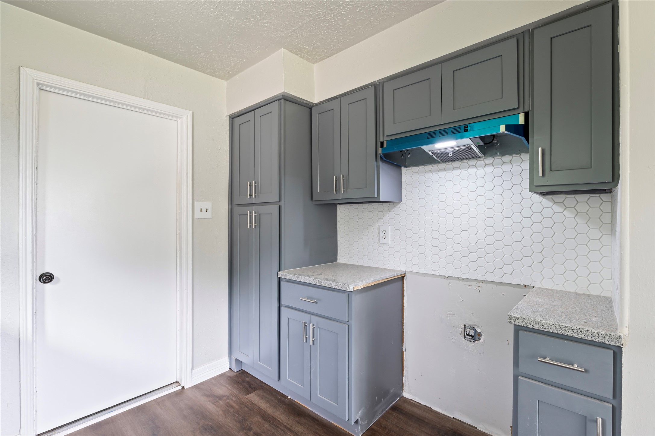 15050 Blueridge Road Missouri City, TX 77489 - Photo 12 of 30 a kitchen with cabinets and a refrigerator