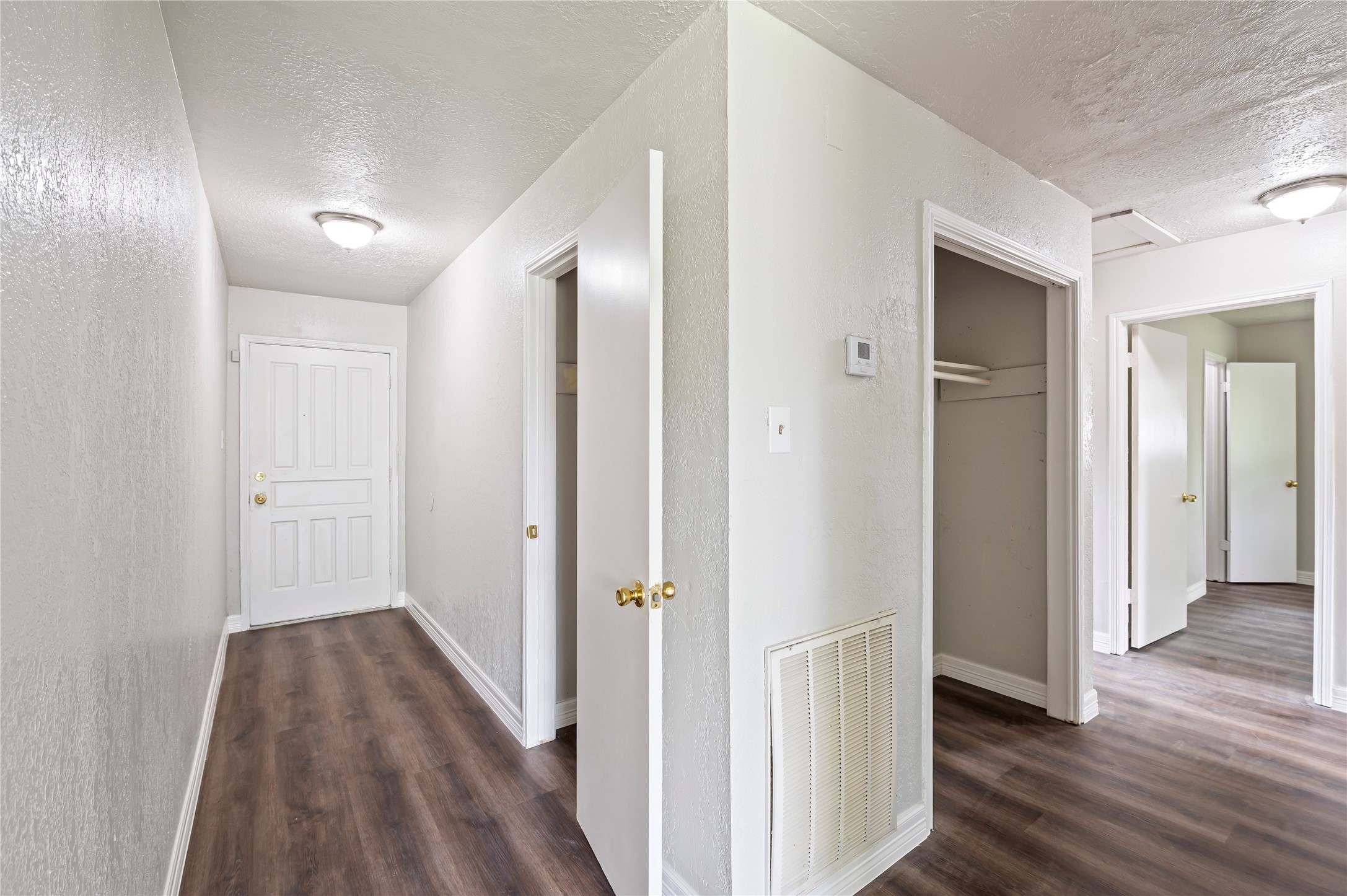 15050 Blueridge Road Missouri City, TX 77489 - Photo 13 of 30 a view of a hallway with wooden floor