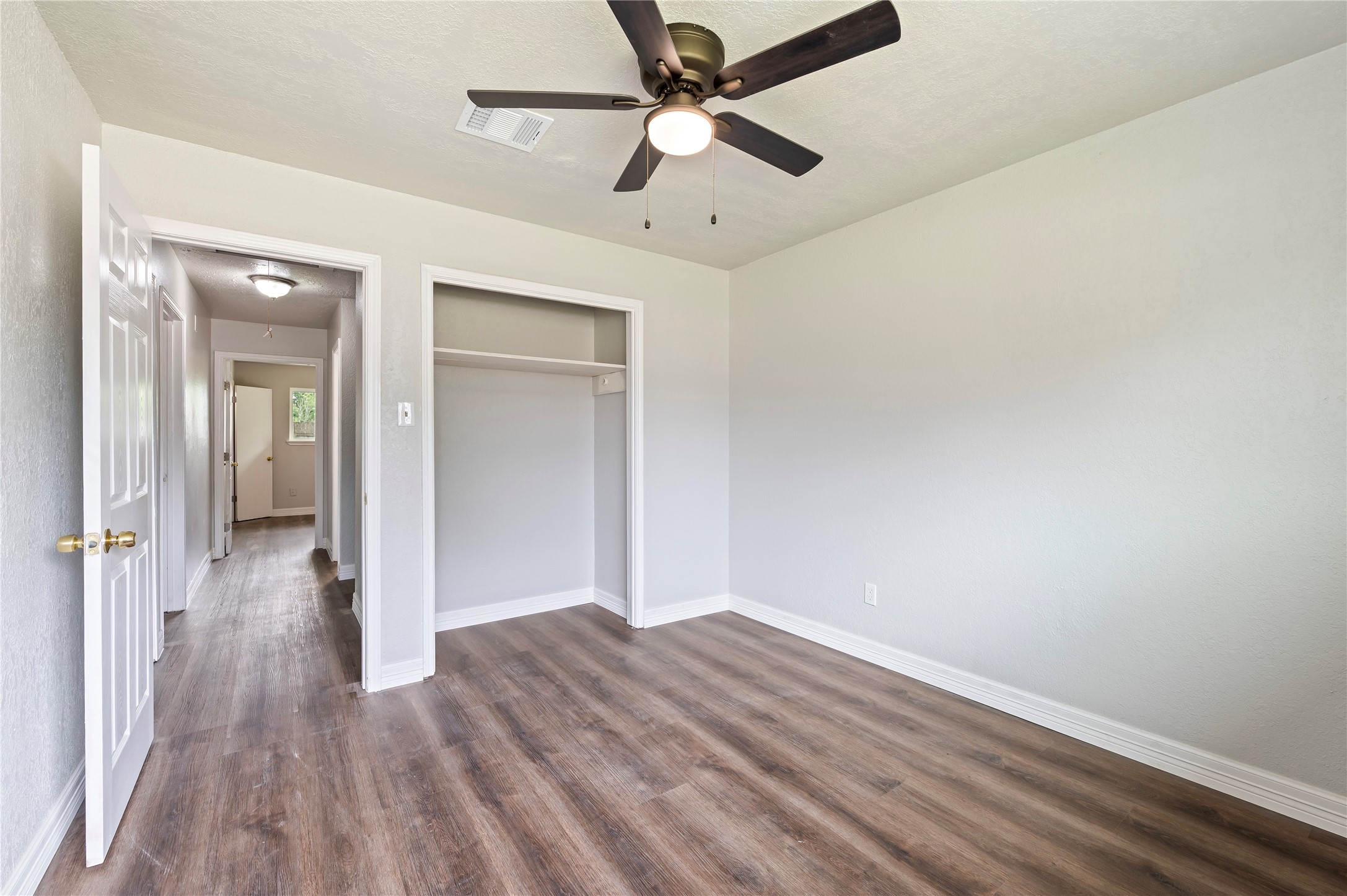 15050 Blueridge Road Missouri City, TX 77489 - Photo 15 of 30 wooden floor in an empty room
