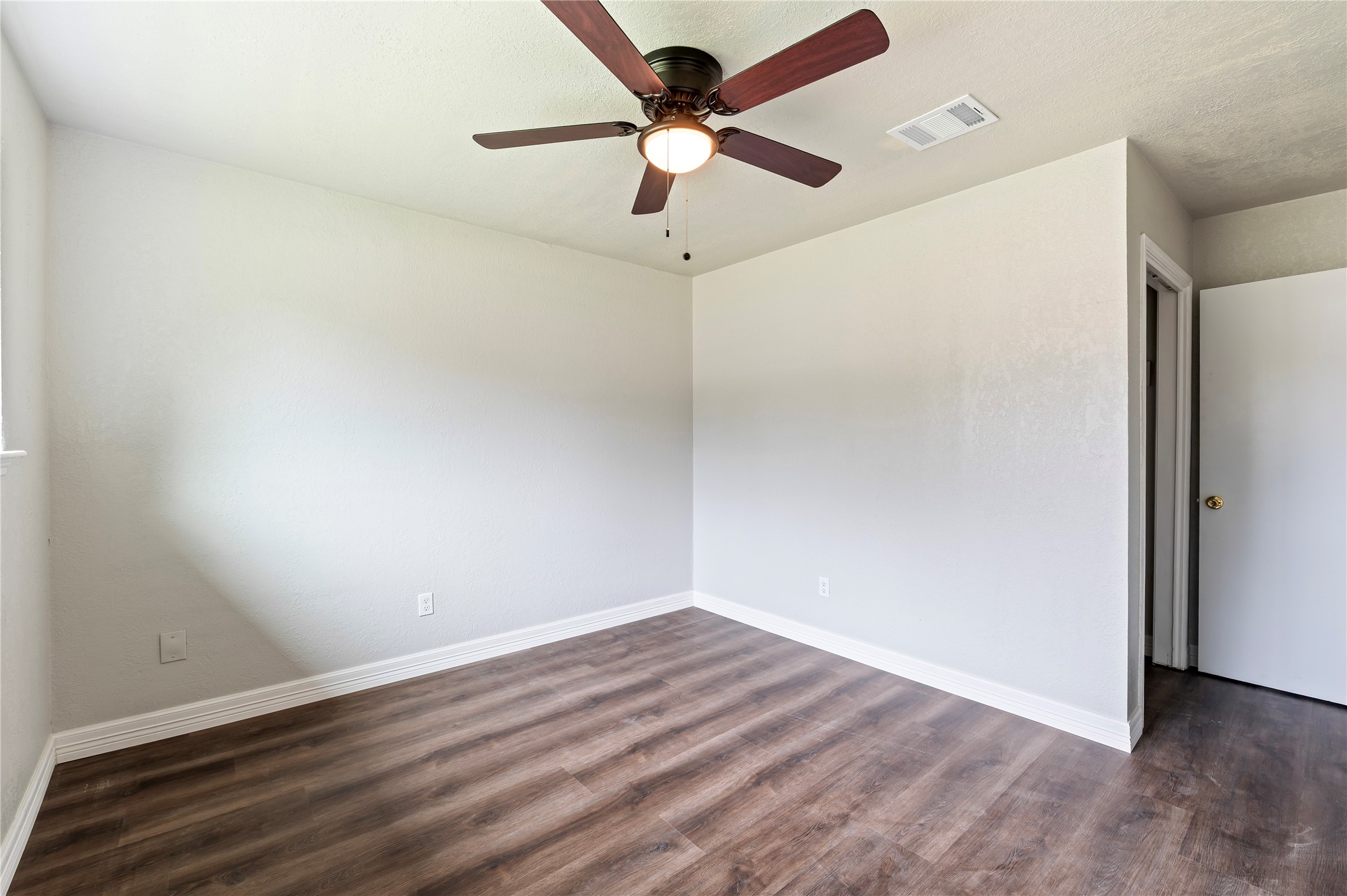 15050 Blueridge Road Missouri City, TX 77489 - Photo 17 of 30 a view of an empty room with a window