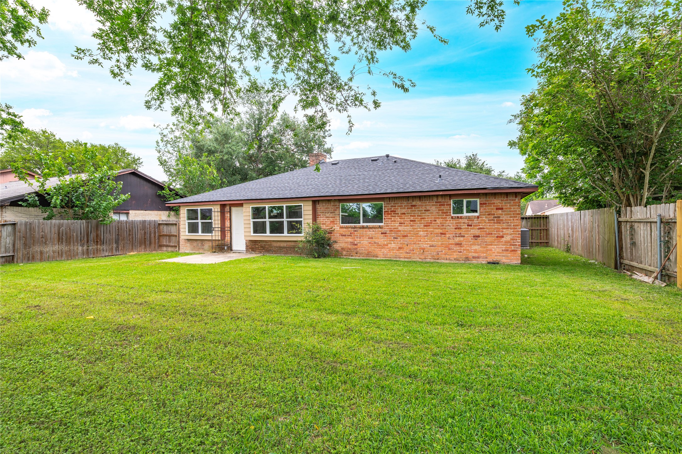 15050 Blueridge Road Missouri City, TX 77489 - Photo 24 of 30 a view of a house with a yard and sitting area