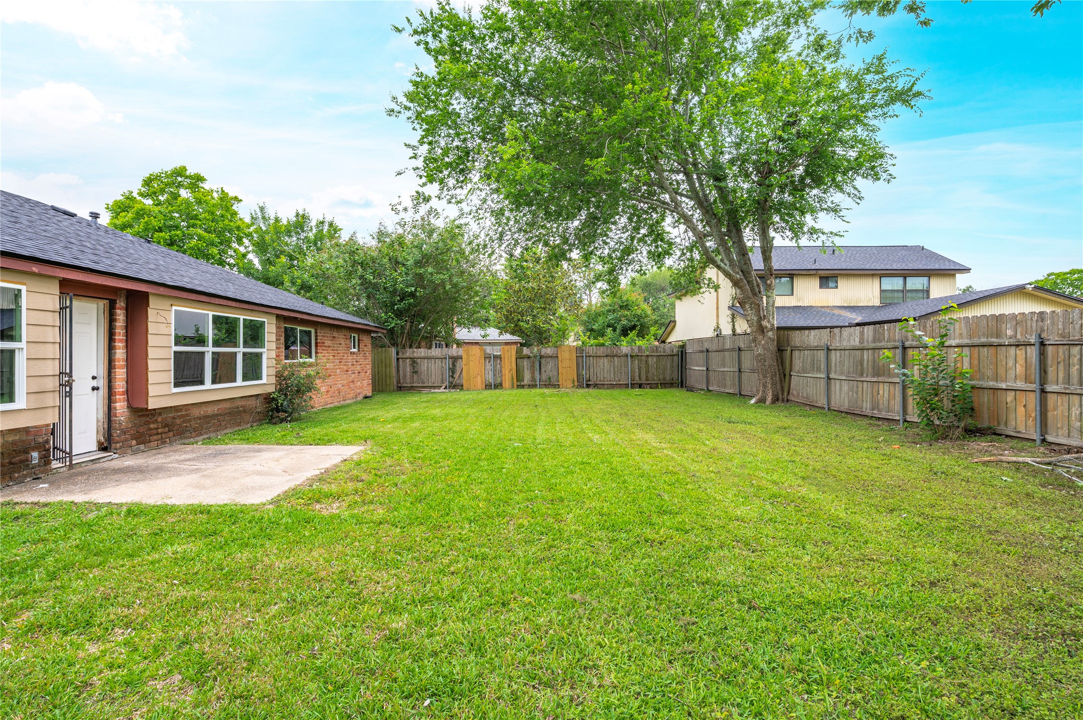 15050 Blueridge Road Missouri City, TX 77489 - Photo 26 of 30 a view of a house with a backyard