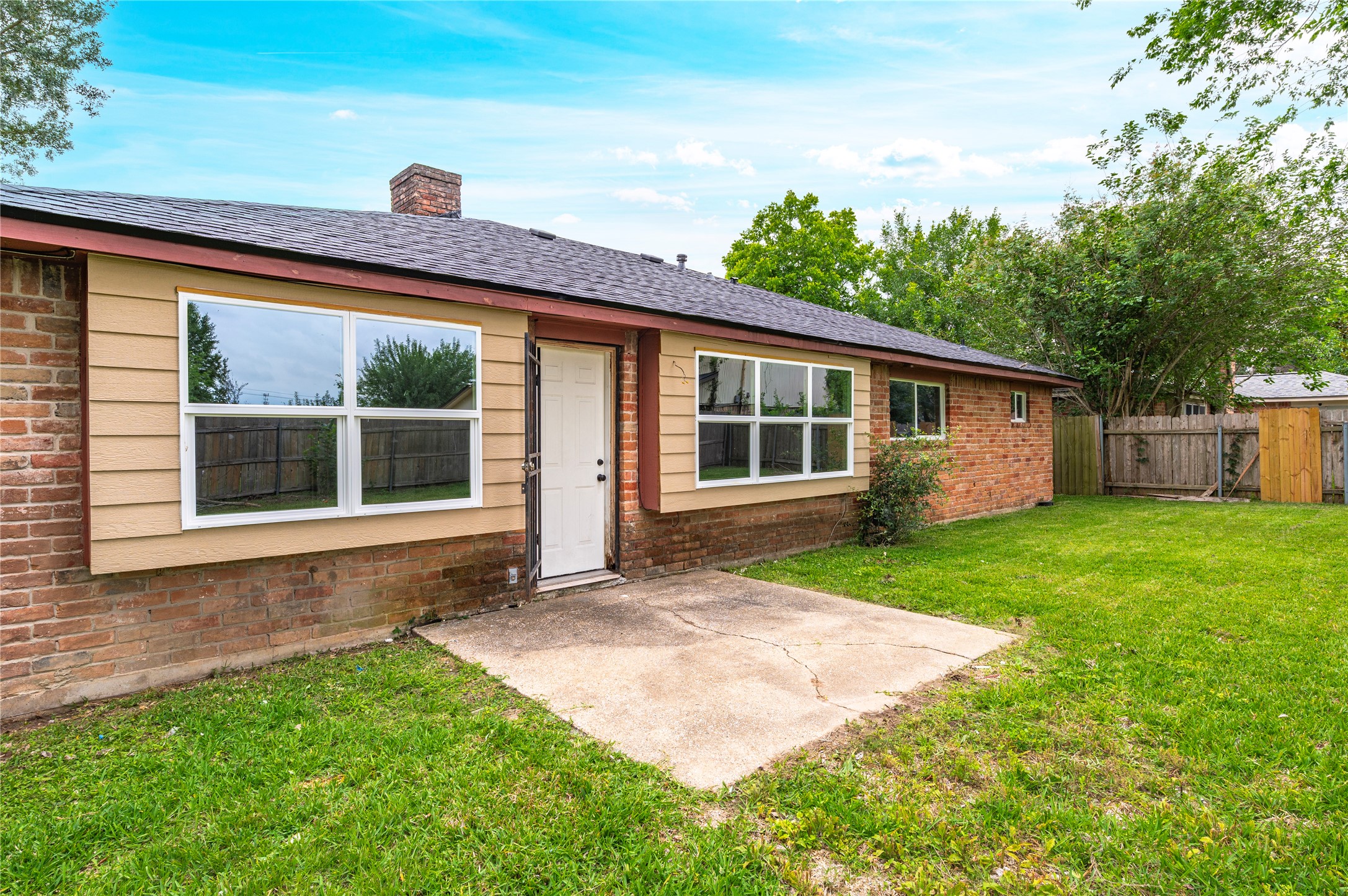 15050 Blueridge Road Missouri City, TX 77489 - Photo 29 of 30 a front view of a house with a garden and yard