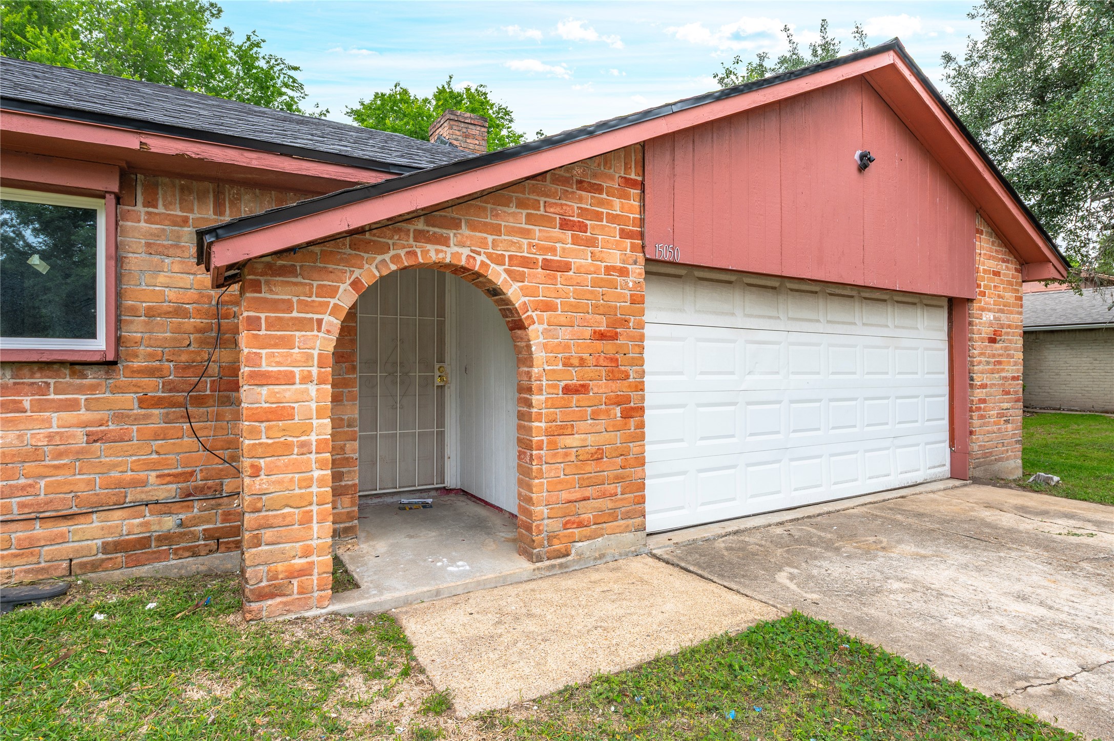15050 Blueridge Road Missouri City, TX 77489 - Photo 3 of 30 a front view of a house with garage