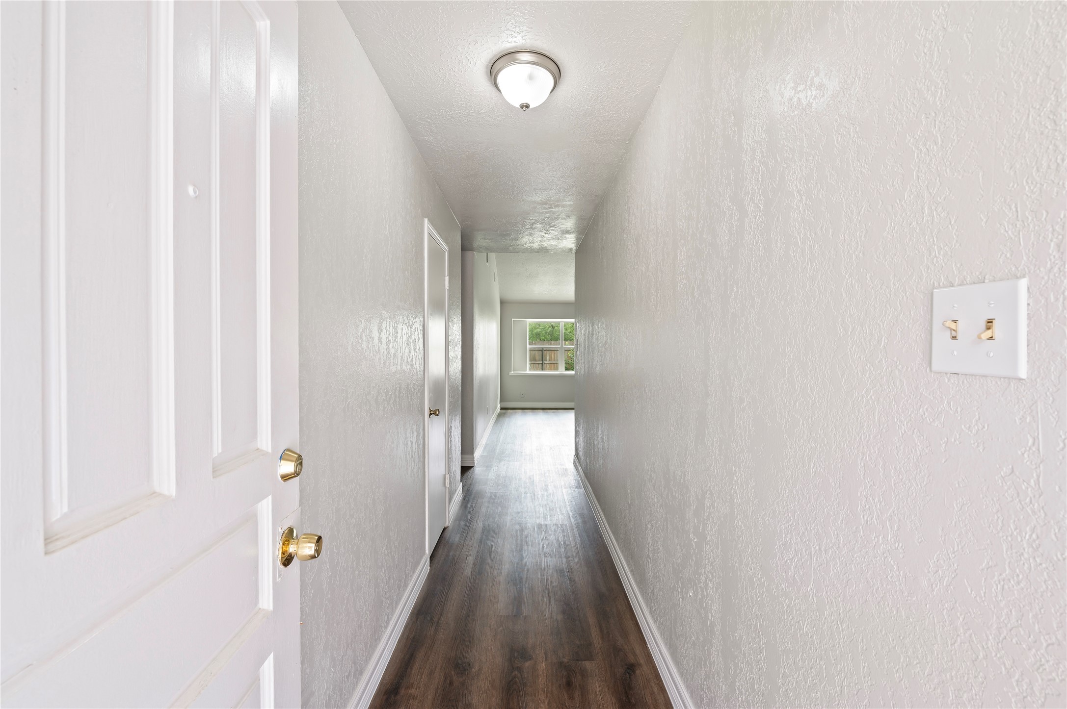 15050 Blueridge Road Missouri City, TX 77489 - Photo 4 of 30 a view of a hallway with wooden floor