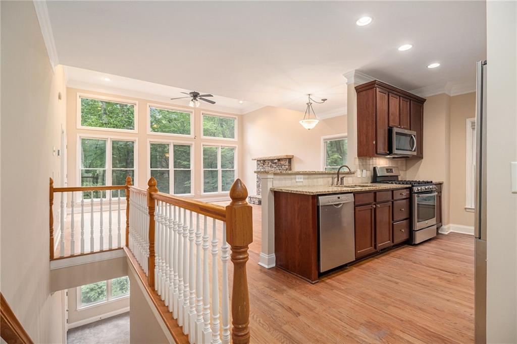 58 Poplar Circle Jasper, GA 30143 - Photo 12 of 31 a kitchen with stainless steel appliances granite countertop a stove a sink and a microwave