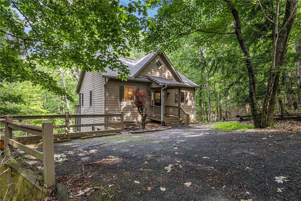 58 Poplar Circle Jasper, GA 30143 - Photo 2 of 31 a front view of a house with garden