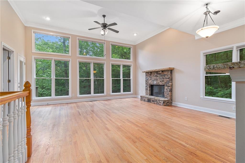 58 Poplar Circle Jasper, GA 30143 - Photo 7 of 31 a view of an empty room with wooden floor fireplace and a window