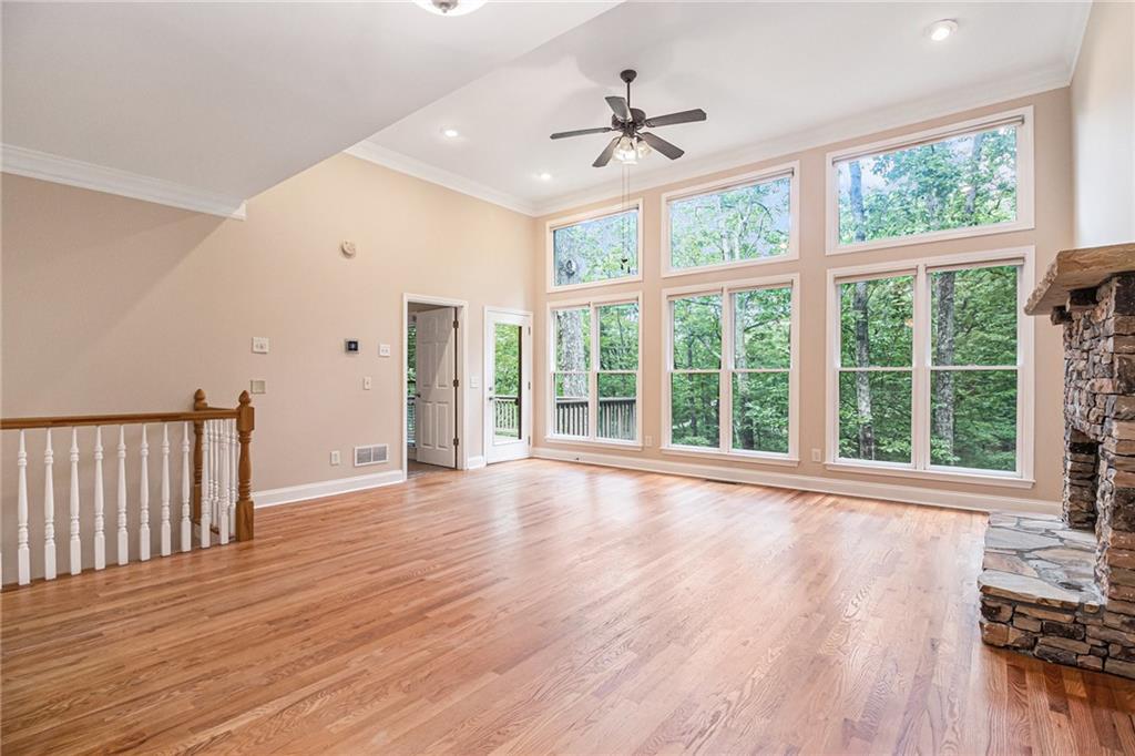 58 Poplar Circle Jasper, GA 30143 - Photo 8 of 31 a view of an empty room with wooden floor and a window