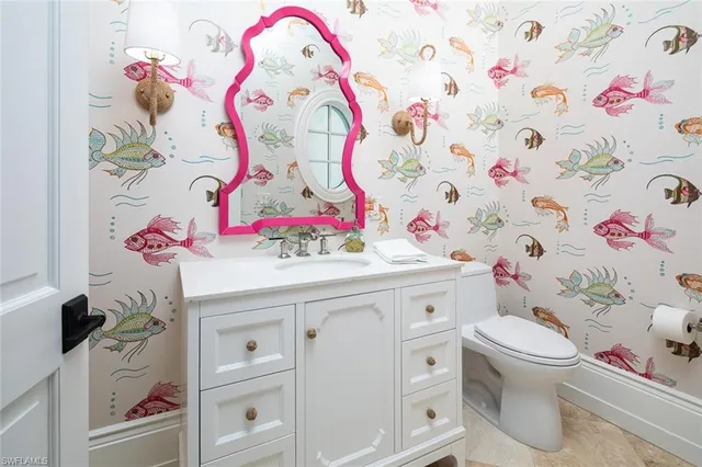 a bathroom with a sink toilet and vanity