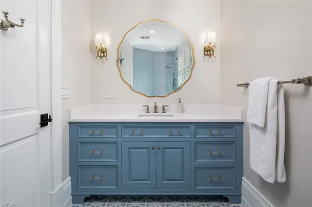 a bathroom with a double vanity sink and a mirror