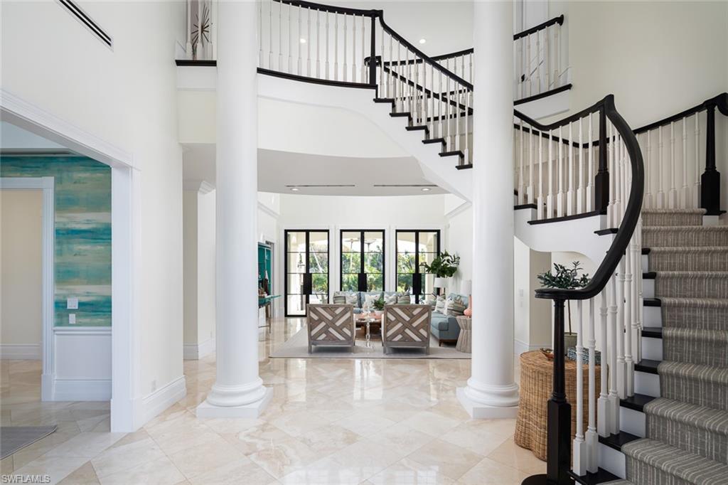 2595 Half Moon Walk Naples, FL 34102 - Photo 3 of 48 a view of entryway livingroom and hall with wooden floor