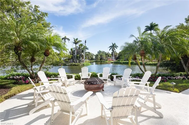a view of a lake with furniture