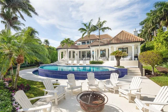 a view of a patio with couches chairs and a potted plants