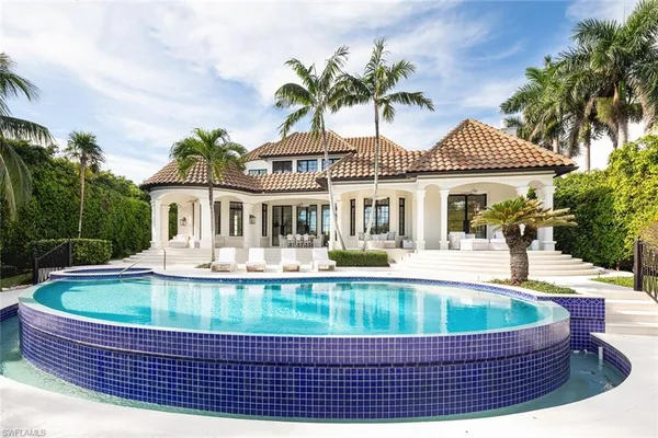 a front view of a house with a swimming pool