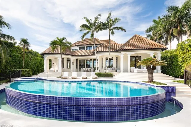 a front view of a house with a swimming pool