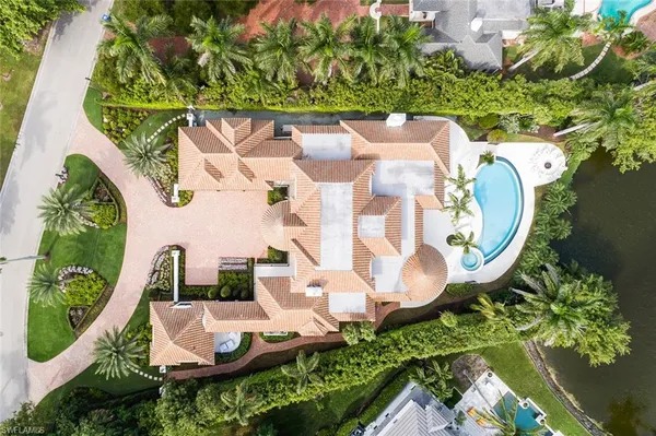 an aerial view of a house with a swimming pool