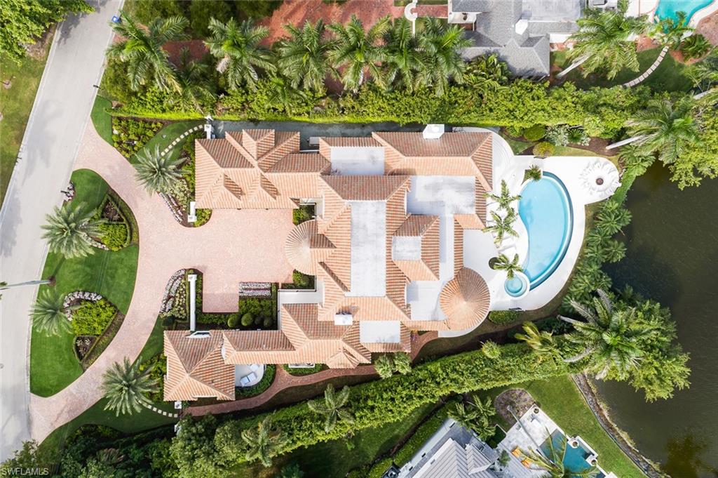 2595 Half Moon Walk Naples, FL 34102 - Photo 46 of 48 an aerial view of a house with a swimming pool