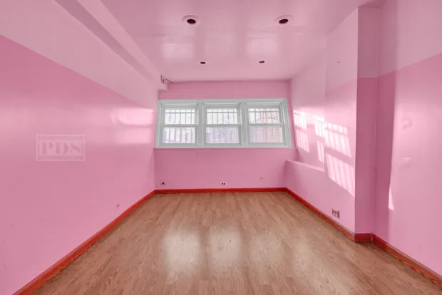 a view of an empty room and window