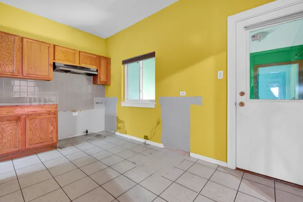 a view of a kitchen with utility area