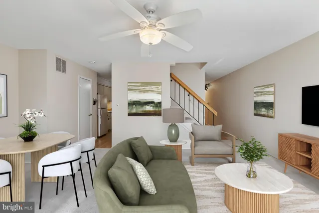 a living room with furniture and a table