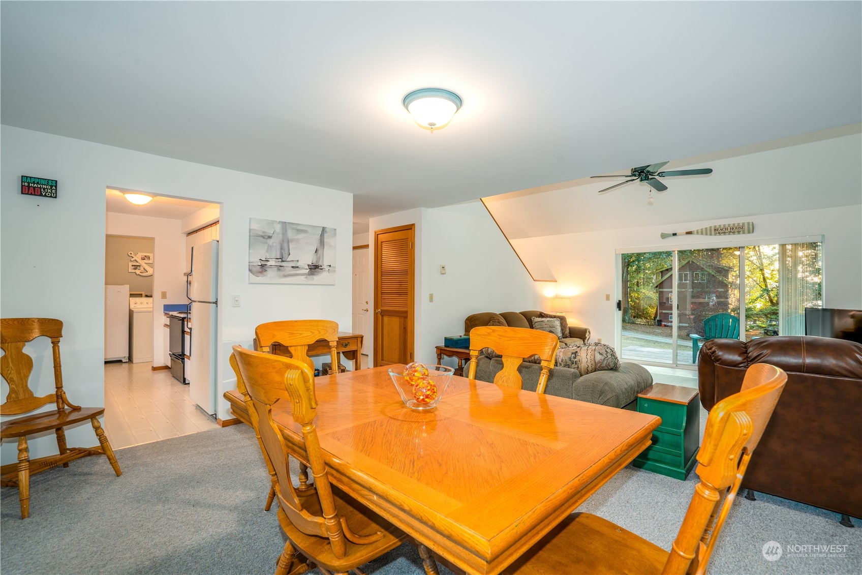 83-B Port Gardner Drive Hat Island, WA 98201 - Photo 11 of 33 a dining room with furniture and wooden floor