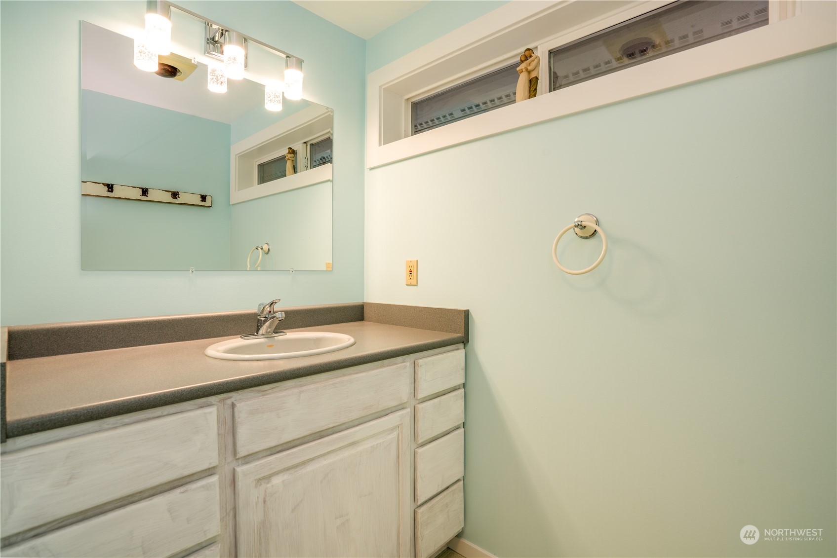 83-B Port Gardner Drive Hat Island, WA 98201 - Photo 15 of 33 a bathroom with a granite countertop sink and a mirror
