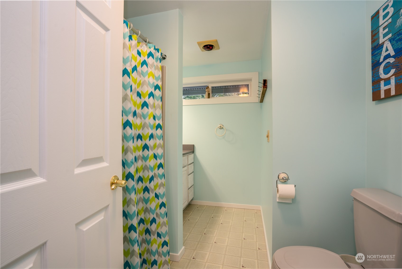 83-B Port Gardner Drive Hat Island, WA 98201 - Photo 16 of 33 a bathroom with a shower curtain and a toilet
