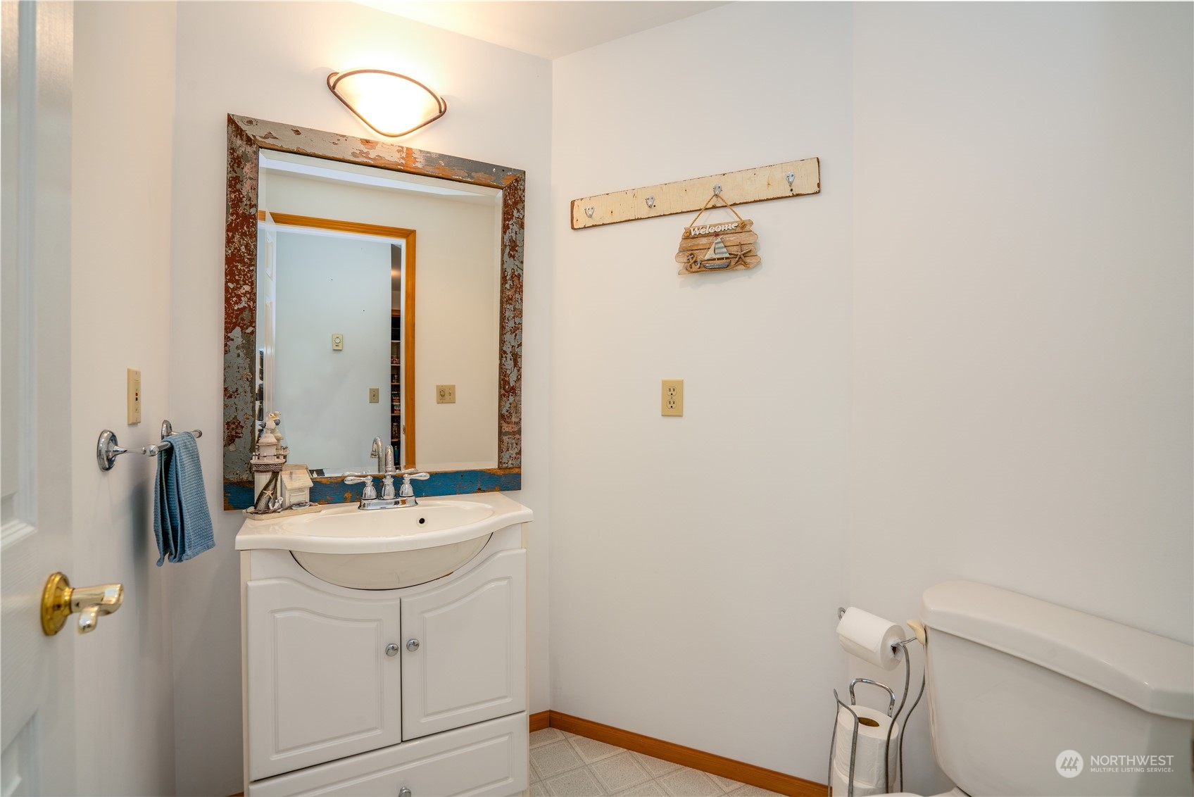83-B Port Gardner Drive Hat Island, WA 98201 - Photo 17 of 33 a bathroom with a sink a toilet and mirror