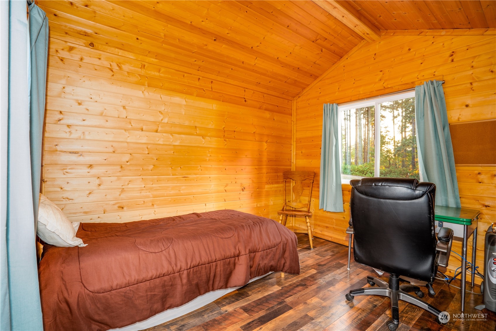 83-B Port Gardner Drive Hat Island, WA 98201 - Photo 19 of 33 a bedroom with a bed and chair