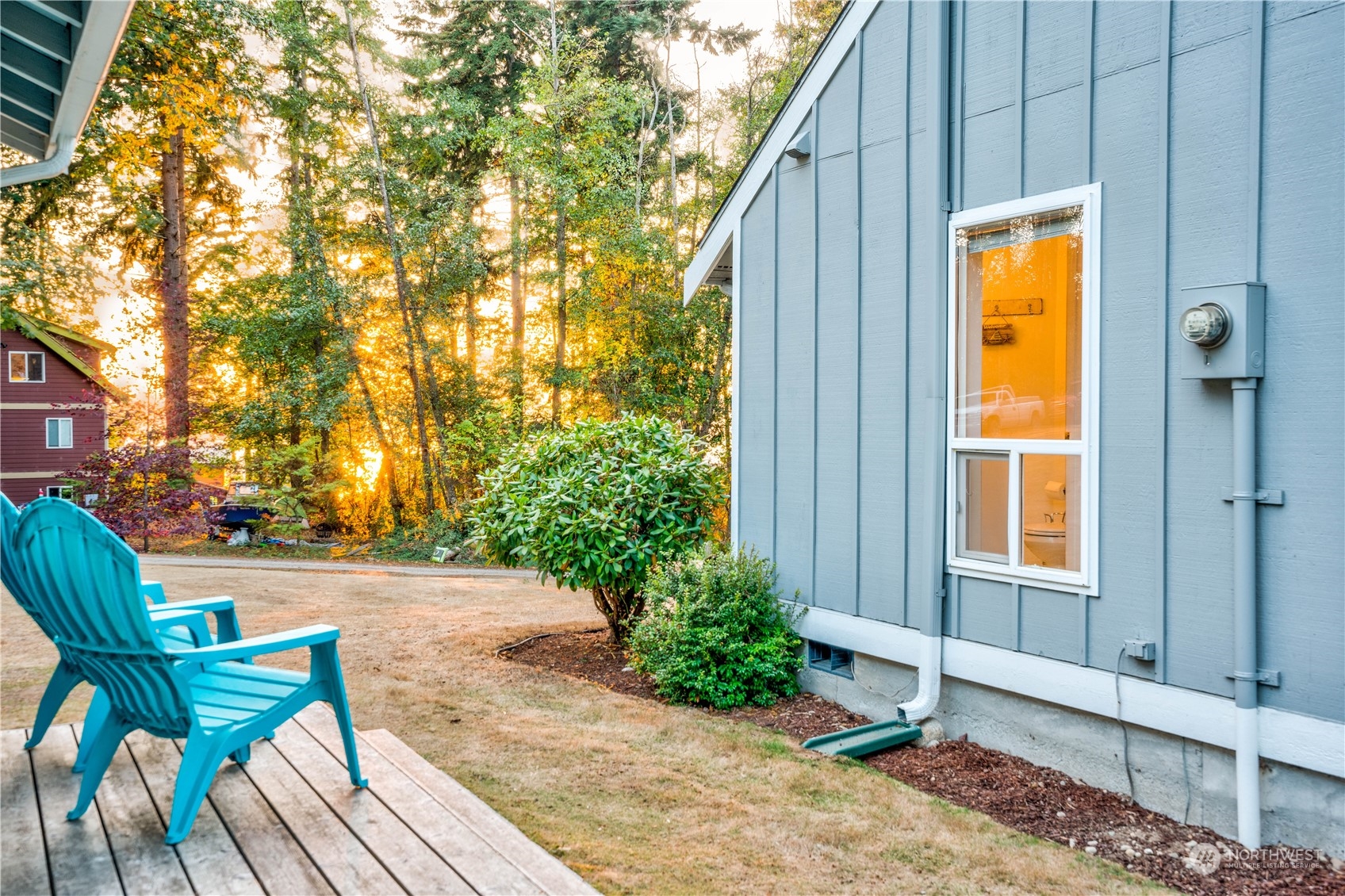 83-B Port Gardner Drive Hat Island, WA 98201 - Photo 3 of 33 a front view of a house with garden