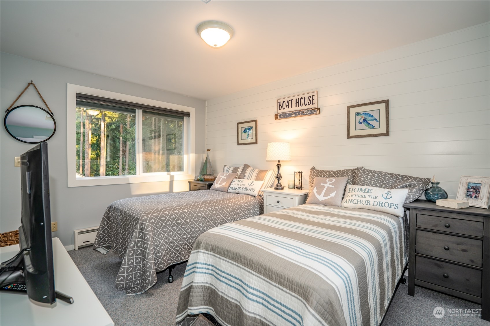 83-B Port Gardner Drive Hat Island, WA 98201 - Photo 6 of 33 a bedroom with a bed and a window