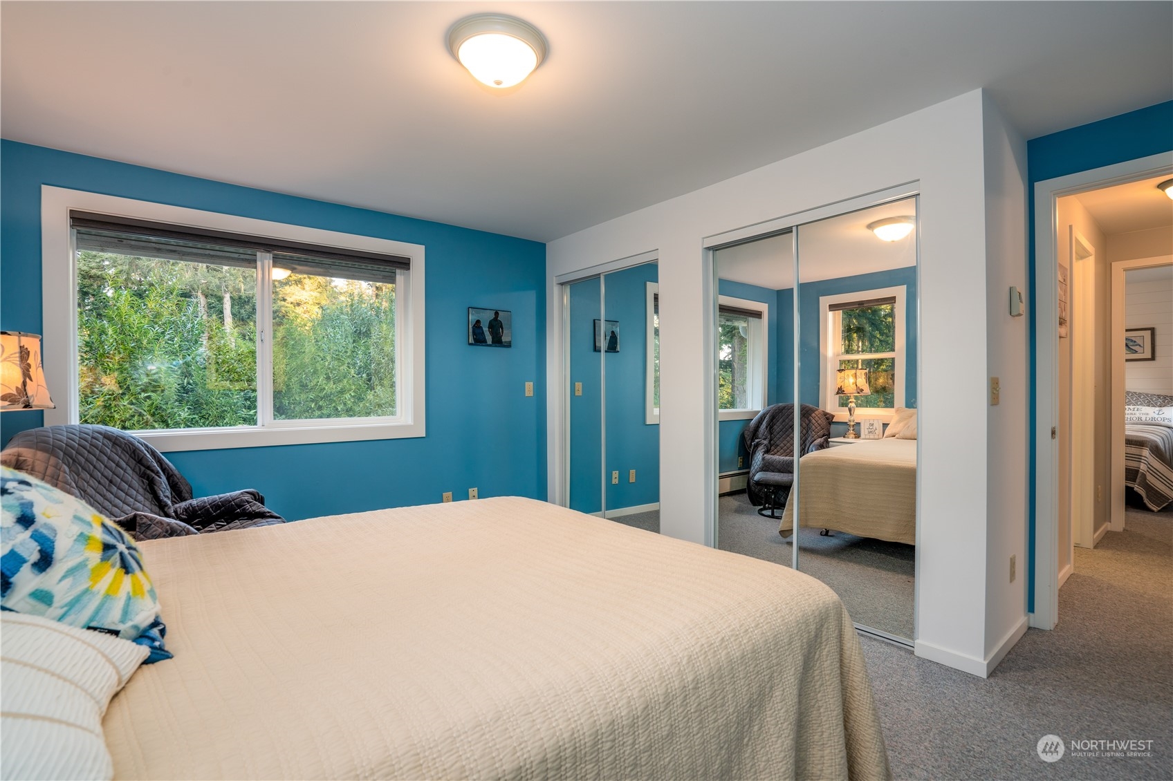 83-B Port Gardner Drive Hat Island, WA 98201 - Photo 8 of 33 a bedroom with a bed and wooden floor