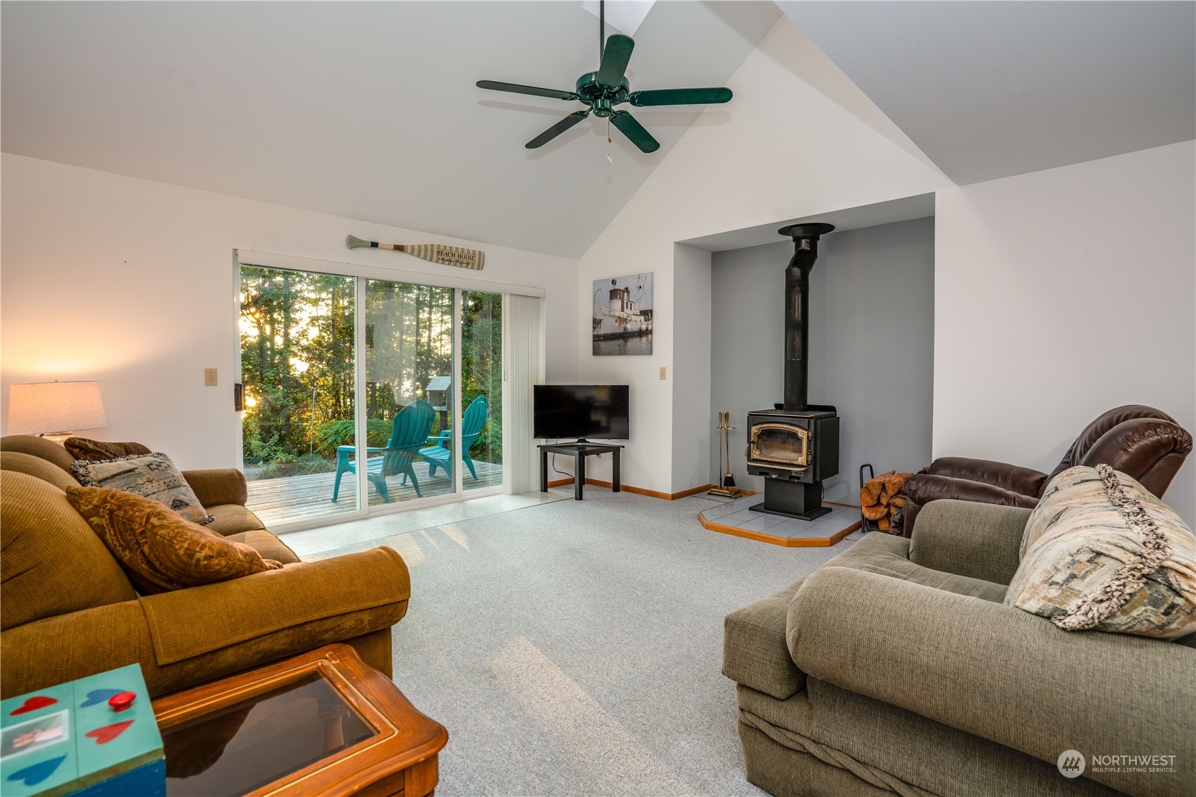 83-B Port Gardner Drive Hat Island, WA 98201 - Photo 10 of 33 a living room with furniture and a fireplace